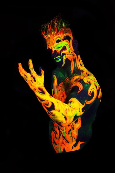 Body art glowing in ultraviolet light — Stock Photo, Image