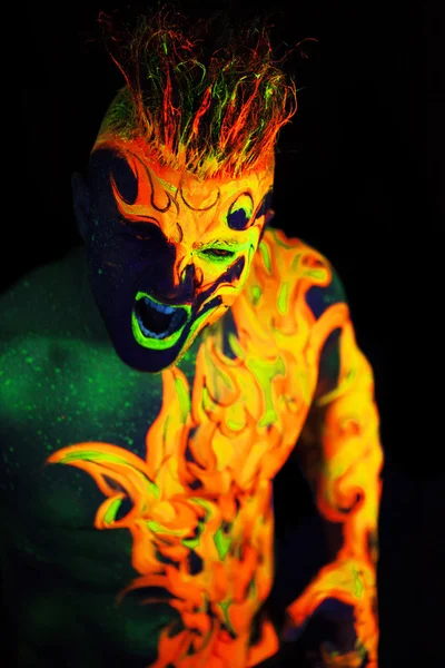 Body art glowing in ultraviolet light — Stock Photo, Image