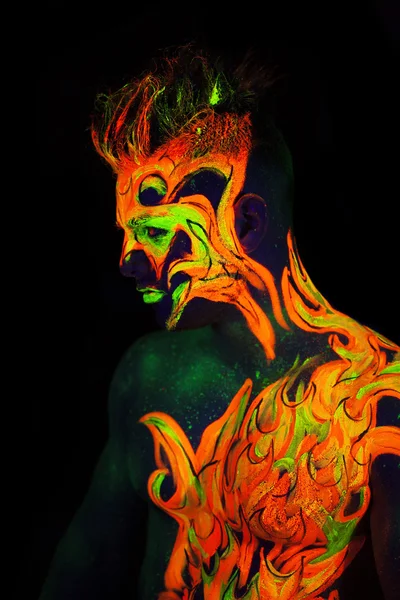 Body art glowing in ultraviolet light — Stock Photo, Image