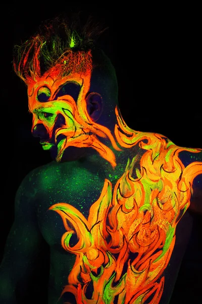 Body art glowing in ultraviolet light — Stock Photo, Image