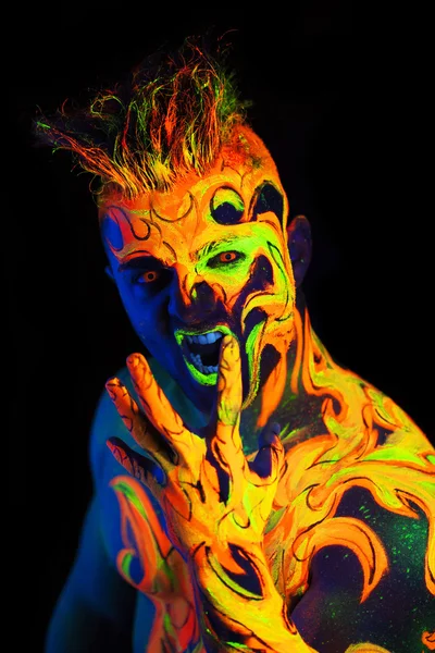 Body art glowing in ultraviolet light — Stock Photo, Image