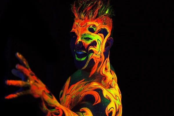 Body art glowing in ultraviolet light — Stock Photo, Image