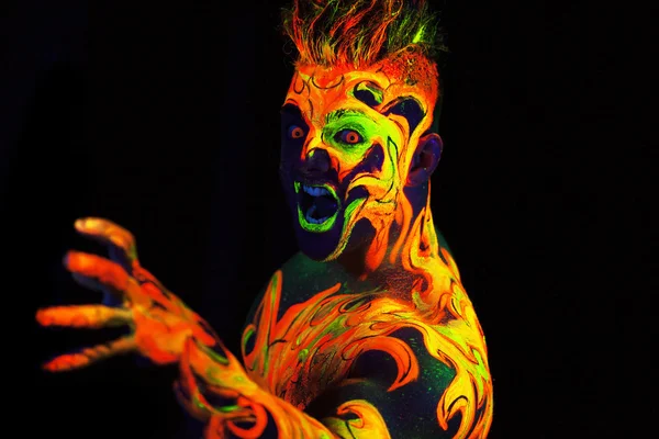 Body art glowing in ultraviolet light — Stock Photo, Image