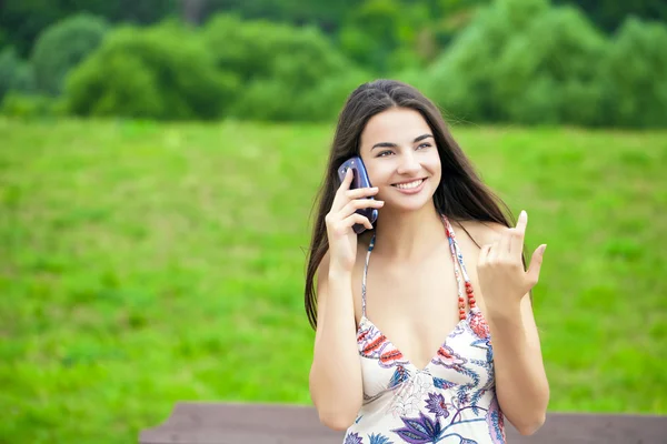 Happy beautiful girl calling by phone — Stock Photo, Image