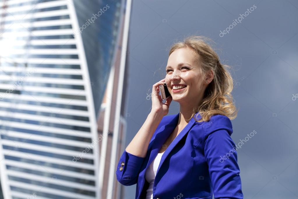 Beautiful young blonde calling by phone