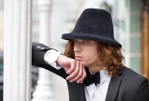 Portrait of a young businessman in designer hat — Stock Photo, Image