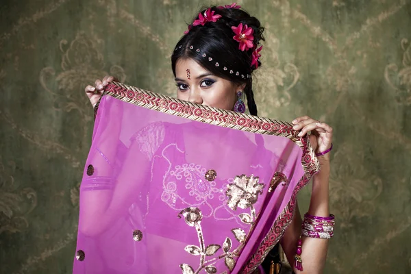 Young pretty woman in indian red dress — Stock Photo, Image