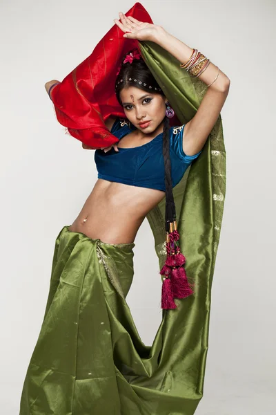 Young pretty woman in indian green dress — Stock Photo, Image