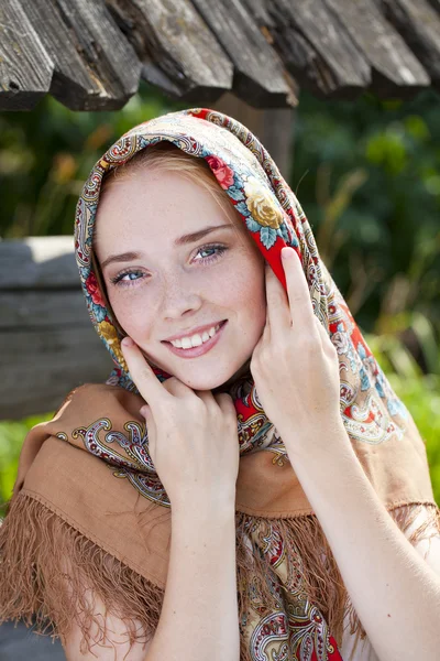 Beauty woman in the national patterned scarf — Stock Photo, Image