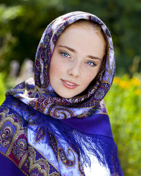 Beauty woman in the national patterned scarf — Stock Photo, Image