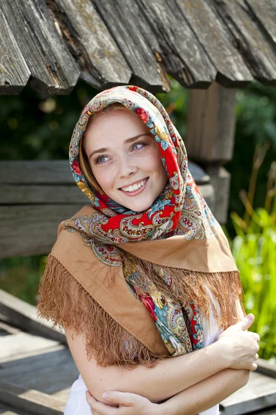 Beauty woman in the national patterned scarf — Stock Photo, Image