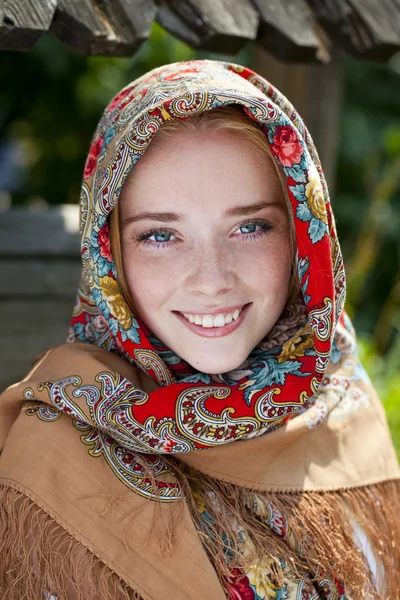 Beauty woman in the national patterned scarf — Stock Photo, Image