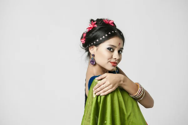 Young pretty woman in indian green dress — Stock Photo, Image