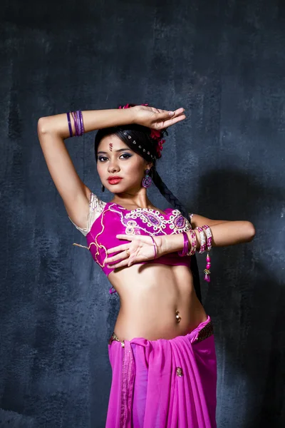 Young pretty woman in indian red dress — Stock Photo, Image