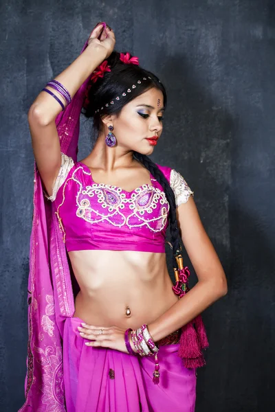 Young pretty woman in indian red dress — Stock Photo, Image