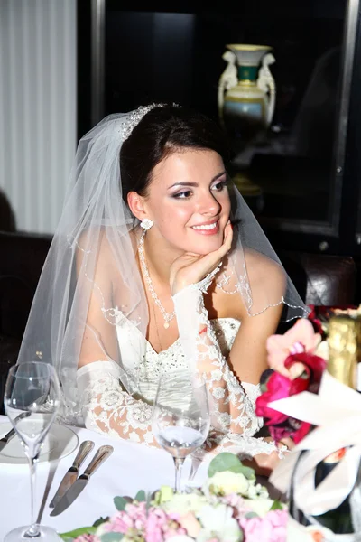 Beautiful bride in unusual wedding dress in the restaurant — Stock Photo, Image