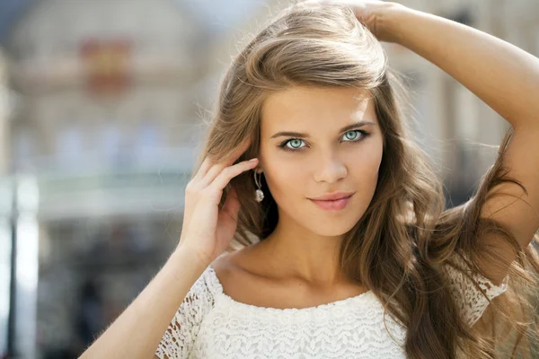 Young beautiful woman in white dress — Stock Photo, Image