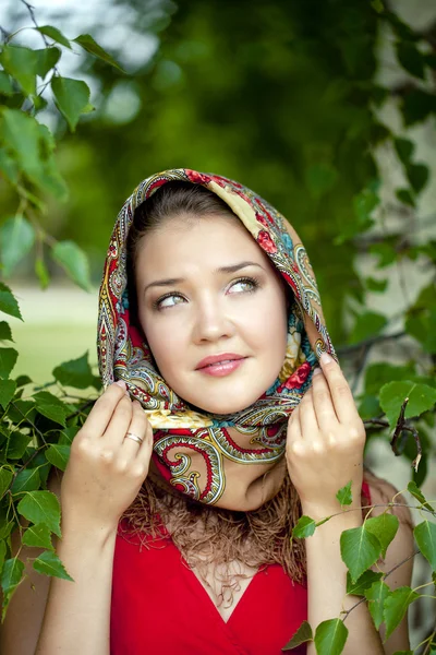 Beauty woman in the national patterned scarf — Stock Photo, Image