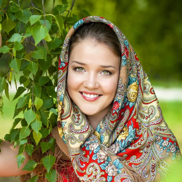 Beauty woman in the national patterned scarf — Stock Photo, Image