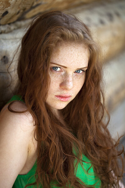 Portrait of the beautiful red haired girl 