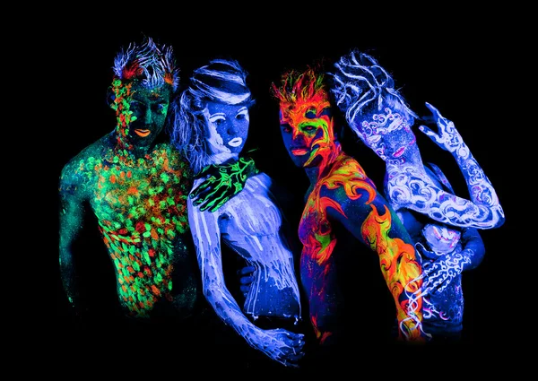 Four - Body art glowing in ultraviolet light — Stock Photo, Image