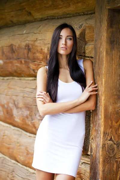 Beautiful young woman in white sexy dress — Stock Photo, Image