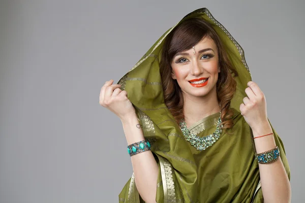 Young pretty woman in indian green dress — Stock Photo, Image