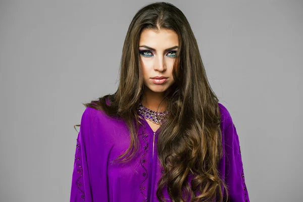 Portrait of the young sexy woman in purple  tunic Arabic — Stock Photo, Image