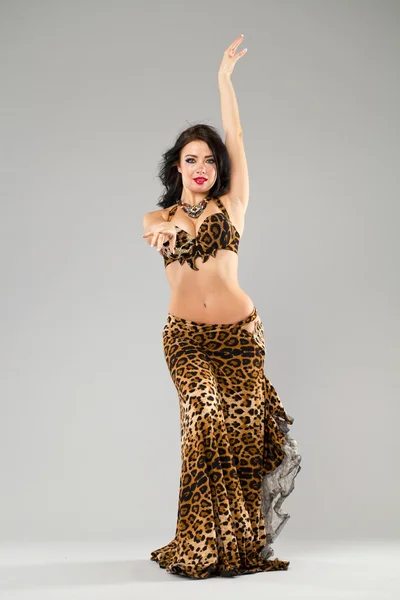 Portrait of the young sexy woman in leopard skirt — Stock Photo, Image