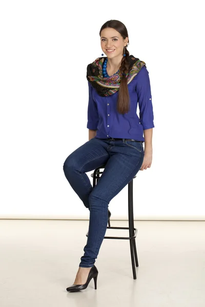 Portrait of a beautiful woman in blue jeans and blue shirt — Stock Photo, Image