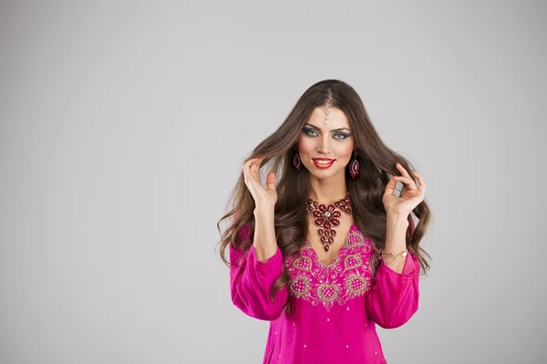 Young pretty woman in indian red dress — Stock Photo, Image