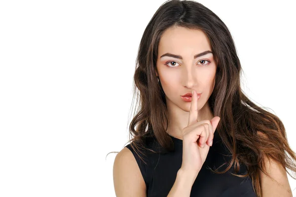 Kvinnan har sätta pekfingret läppar som tecken på tystnad — Stockfoto