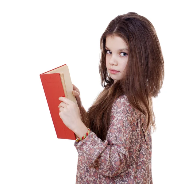 Bambina con in mano un libro rosso — Foto Stock