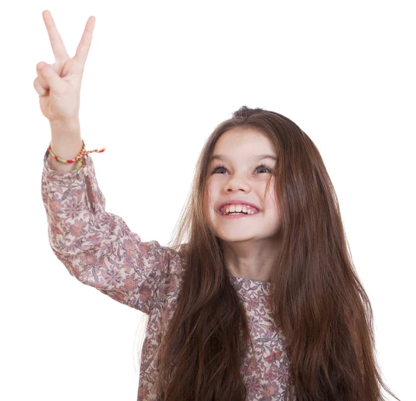Uśmiechnięta dziewczynka w sukni Wyświetlono pokoju gest palcami — Zdjęcie stockowe