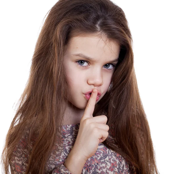 Little girl has put forefinger to lips as sign of silence — Stock Photo, Image