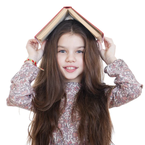 Bambina con in mano un libro rosso — Foto Stock