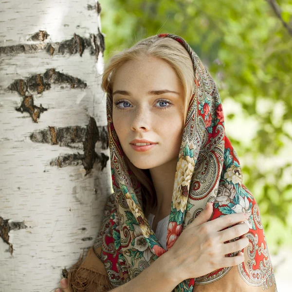 Beauty woman in the national patterned scarf — Stock Photo, Image