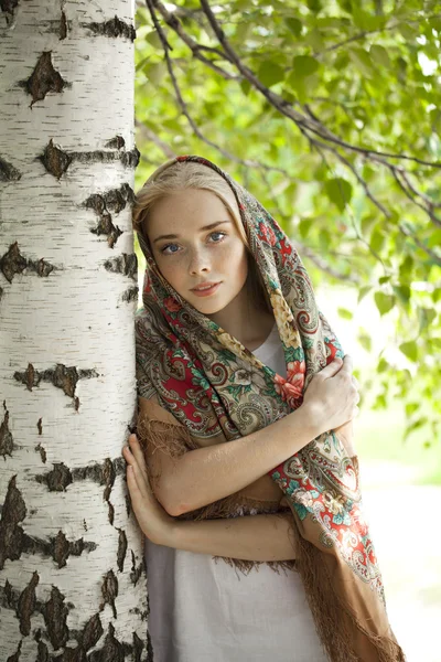 Beauty woman in the national patterned scarf — Stock Photo, Image