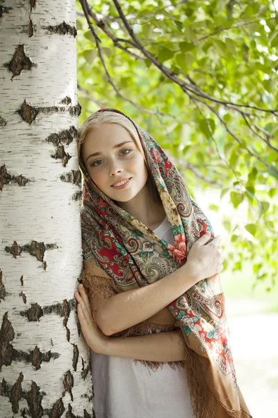 Beauty woman in the national patterned scarf — Stock Photo, Image