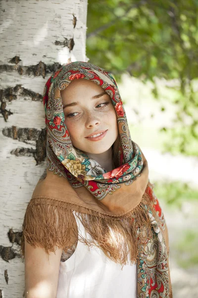 Beauty woman in the national patterned scarf — Stock Photo, Image