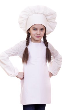 Yemek ve insanlar kavramı - aşçı şapkalı küçük kız gülümseyerek 