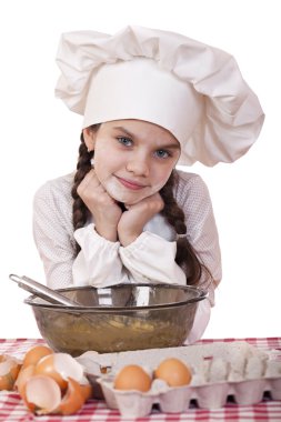 Beyaz bir önlük, küçük kız kalenin yumurta ile tatili.