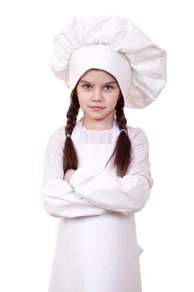 Cozinhar e conceito de pessoas - menina sorridente em chapéu de cozinheiro — Fotografia de Stock