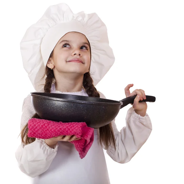 Leende liten flicka i cook mössa med stekpanna — Stockfoto