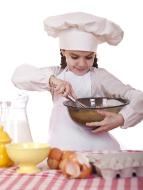 Yemek ve insanlar kavramı - aşçı şapkalı küçük kız gülümseyerek 