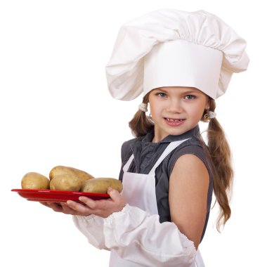 Yemek ve insanlar kavramı - aşçı şapkalı küçük kız gülümseyerek 