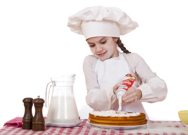 Gotowanie i ludzi pojęcie - uśmiechnięta dziewczynka w kapelusz kucharz — Zdjęcie stockowe