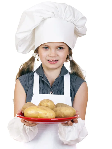 Kochen und Menschen-Konzept - lächelndes kleines Mädchen mit Kochmütze — Stockfoto