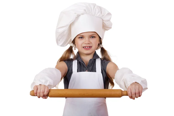 Menina bonito assar na cozinha e mostra rolando-pin, isolado em um fundo branco — Fotografia de Stock