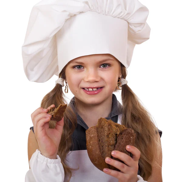 Cooking and people concept - smiling little girl in cook hat — Stock Photo, Image